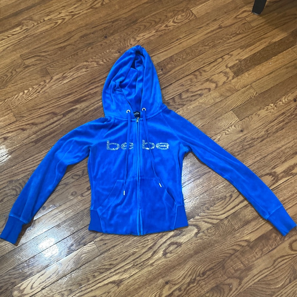 It is a Bebe sweater only worn once ,The color is blue,It is in great condition